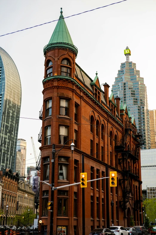 an old building is surrounded by high rise buildings