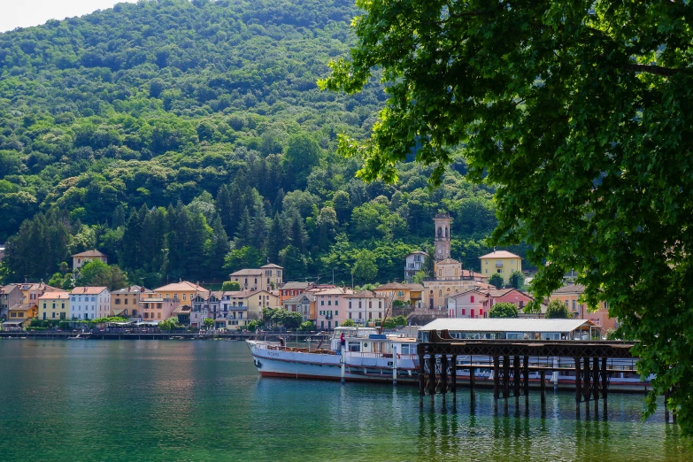 a body of water with boats on it and homes on the side