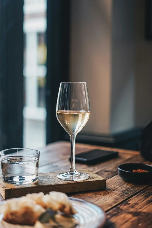 an empty wine glass sitting on top of a table