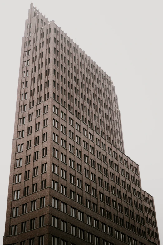 a very tall building sitting in the middle of a street