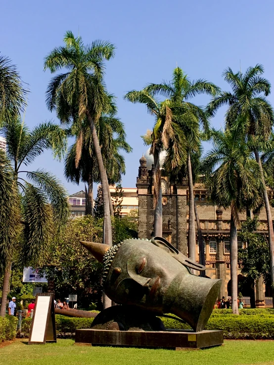 a big building with some large trees on it