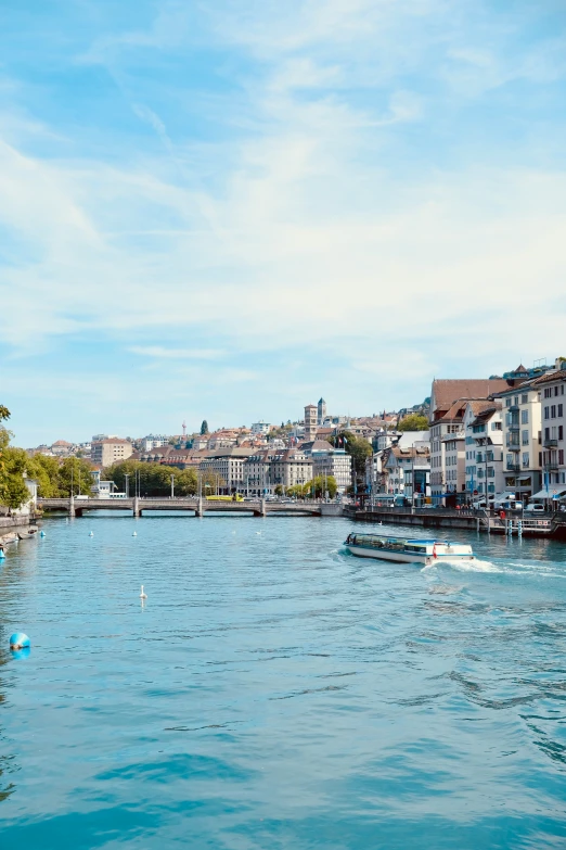 the water near some buildings and boats