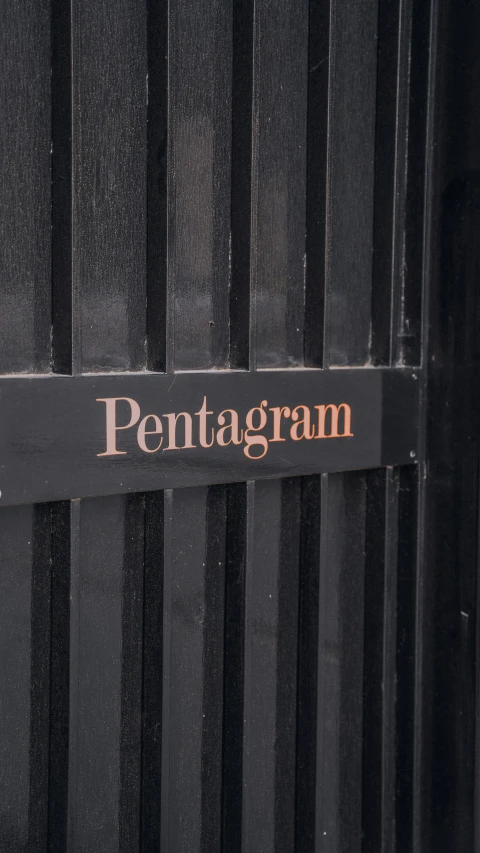 there is a sign that says pentagram on a building