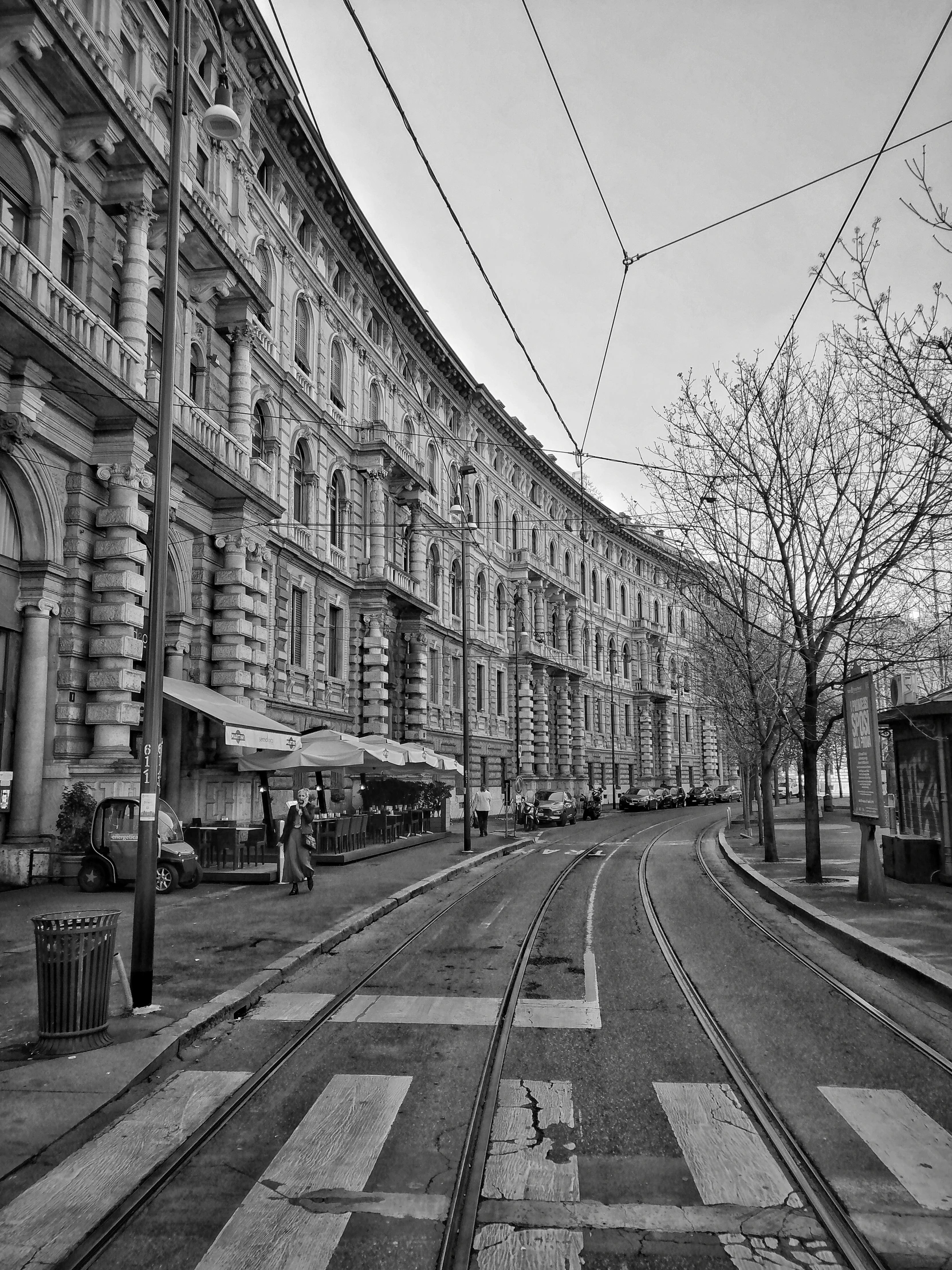 the empty street has many train tracks in it