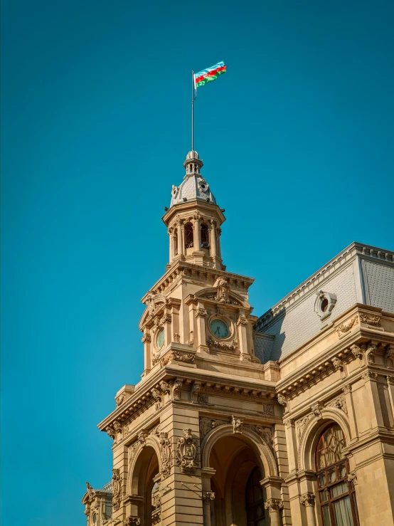 a church steeple with a flagpole on top