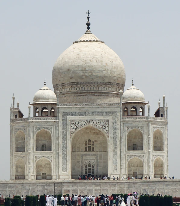 there is a white building with several arches and pillars