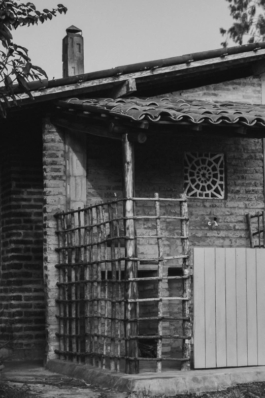 this is an old image of a brick building with a door and ladder