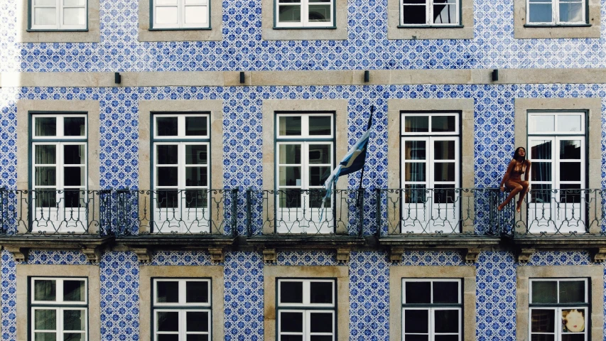 a blue and white building that has a clock on it