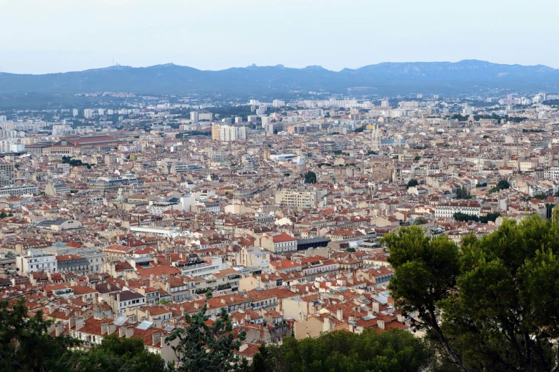 a tall cityscape with lots of buildings surrounding it