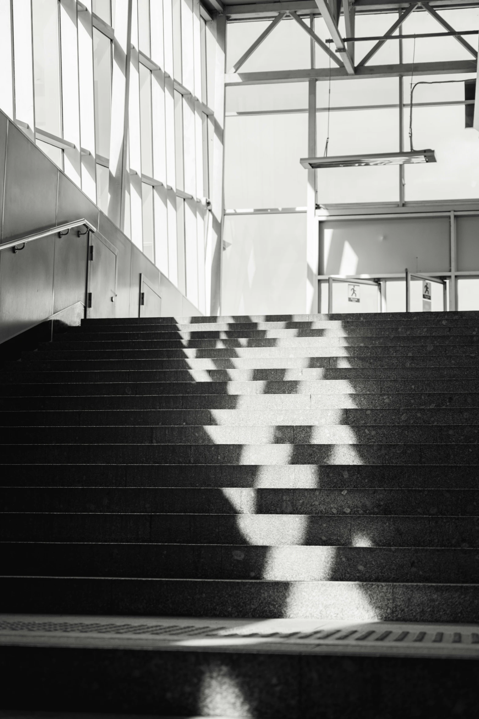 a black and white po of stairs in front of a building