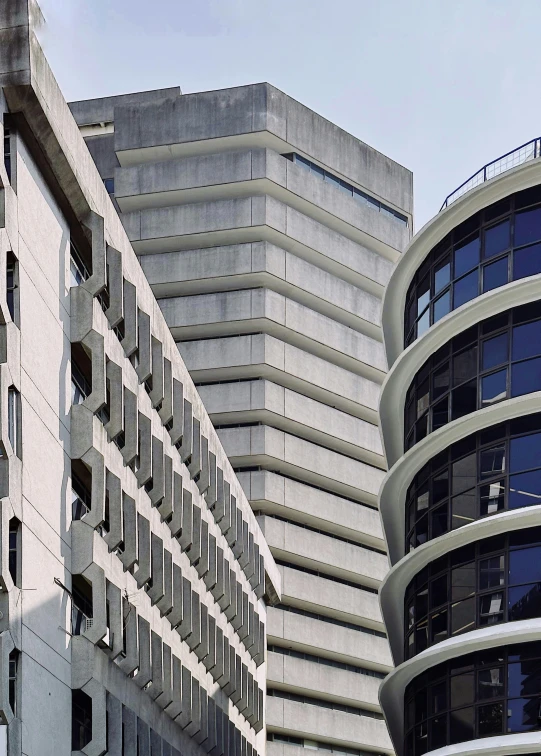 two buildings are outside one another and one is large