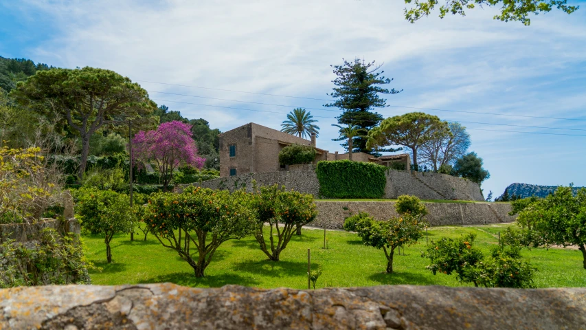 an image of a small villa surrounded by trees