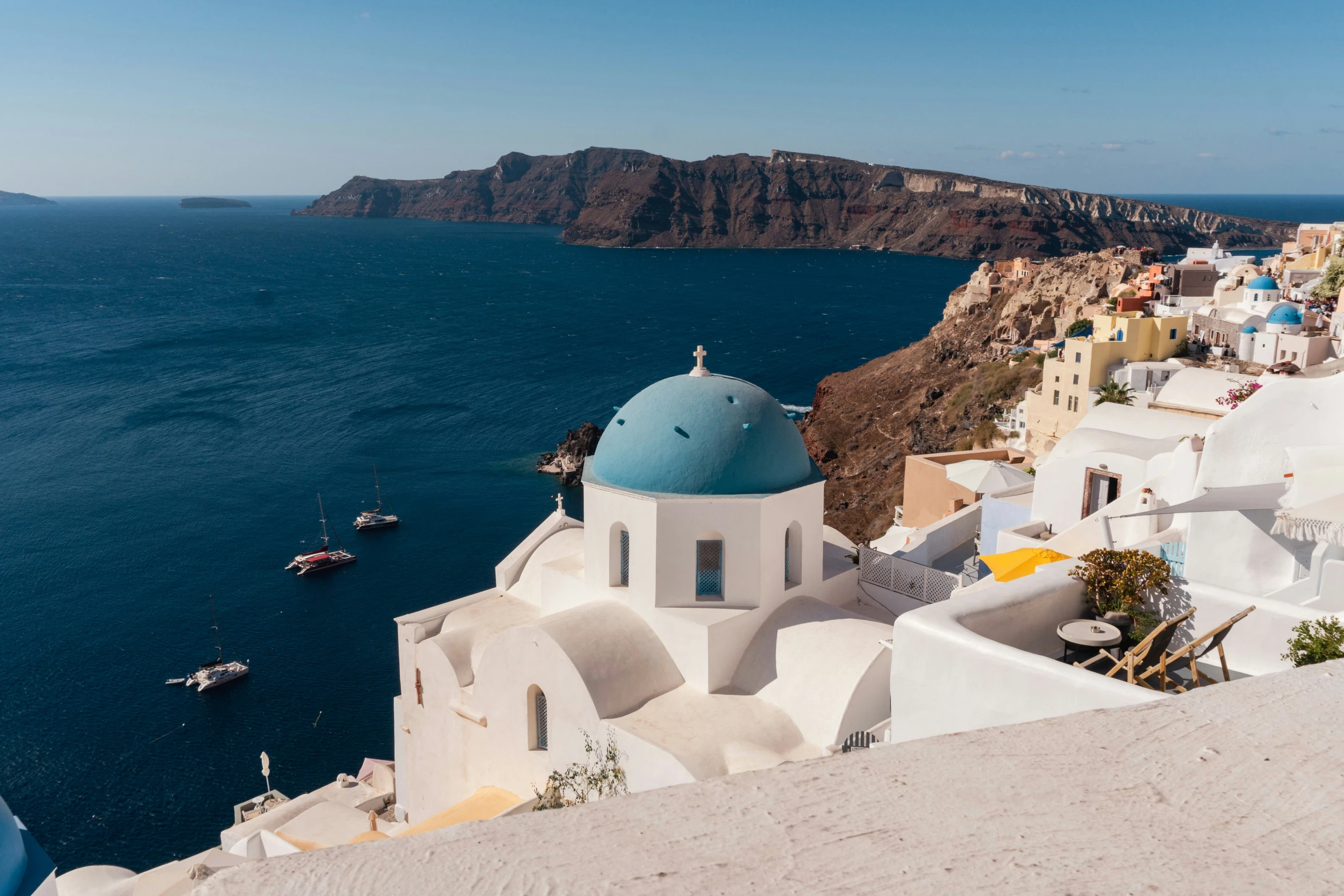 a white church sitting on top of a cliff