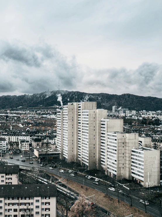 city skyline with white high rise buildings, and fog in the sky