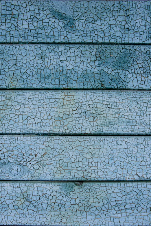 a wall made from various wood panels with paint