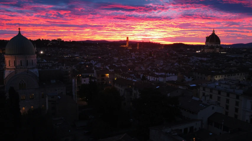 the sky has pink clouds in the background