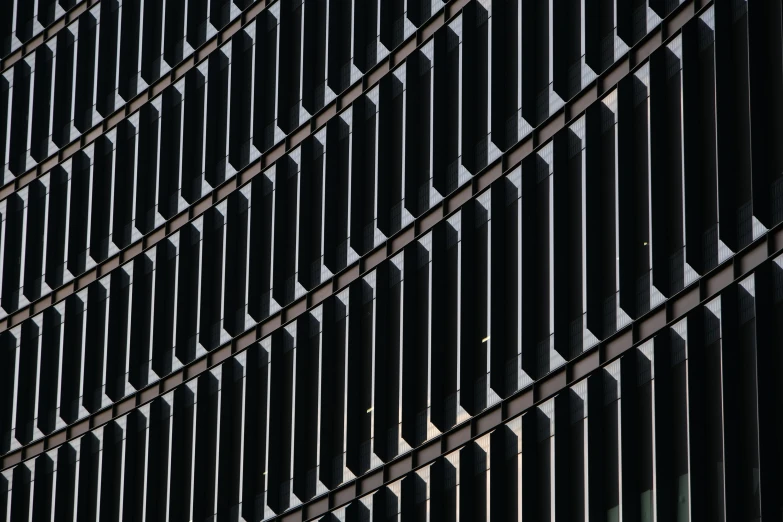 a very close up view of a metal fence