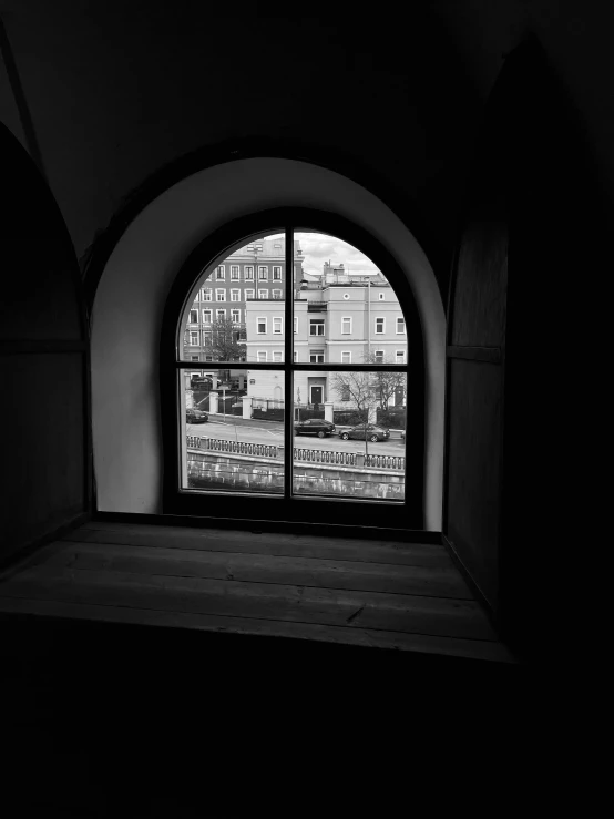 a window looking out into the city outside