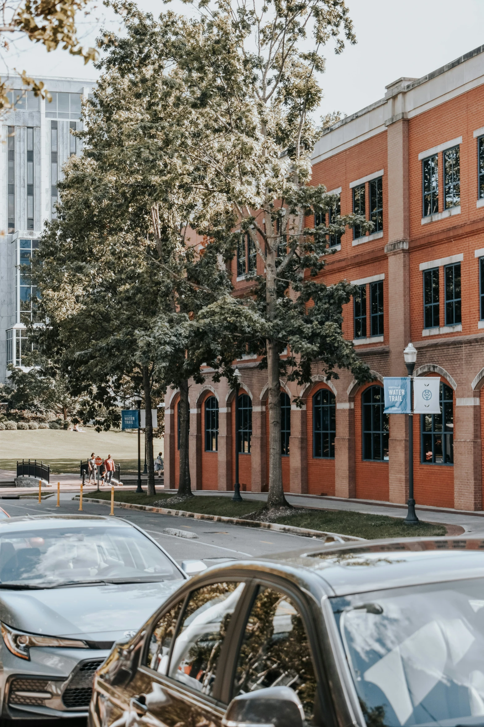 a couple of cars parked on a side walk