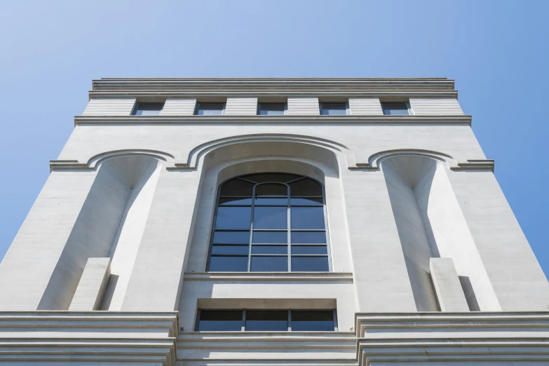 the top of a large building with glass windows