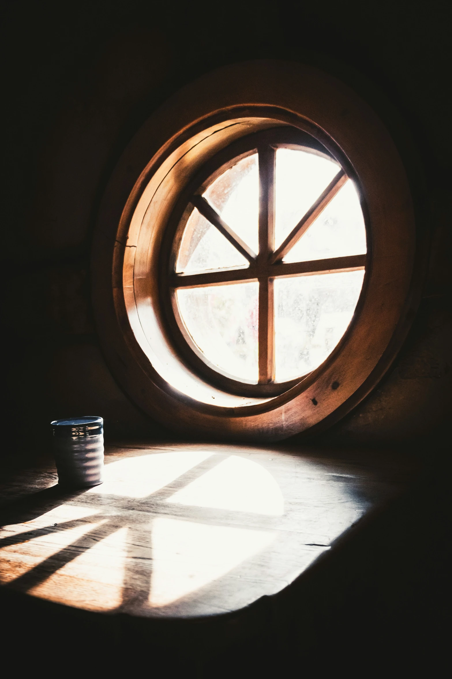 a window of some sort with the sunlight shining through