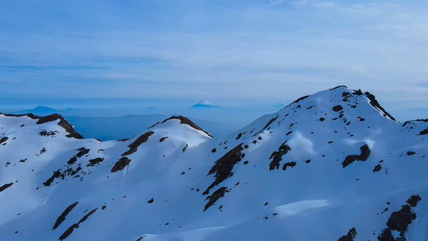 a view of a ski slope in the mountains