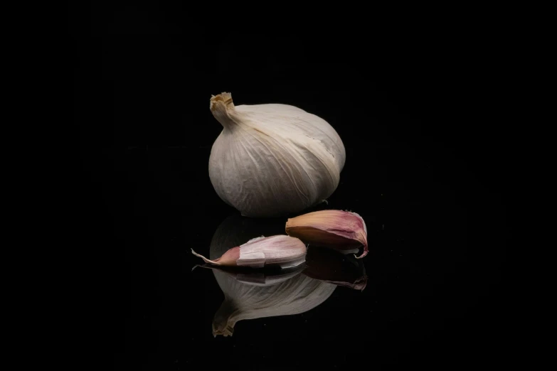 one bulb of garlic and another whole piece of garlic