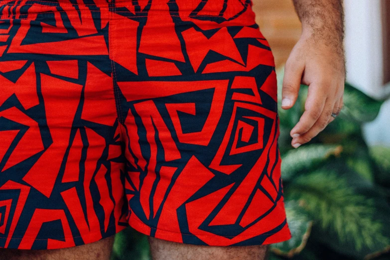 red and blue shorts with black pattern on it