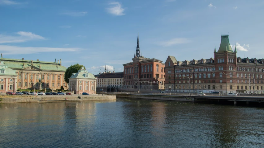 large buildings are next to a body of water