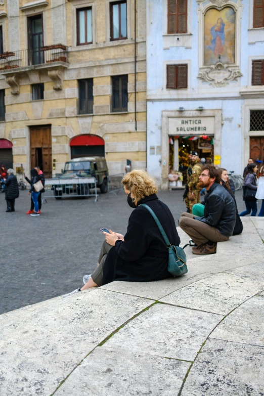 a woman is on her cell phone on the street