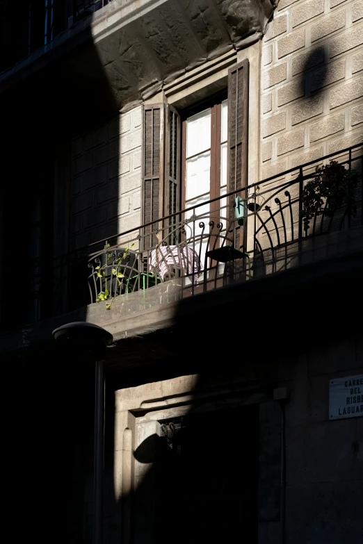 a window is open and on the balcony