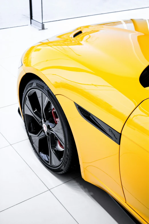 a ferrari sports car parked on a tiled driveway