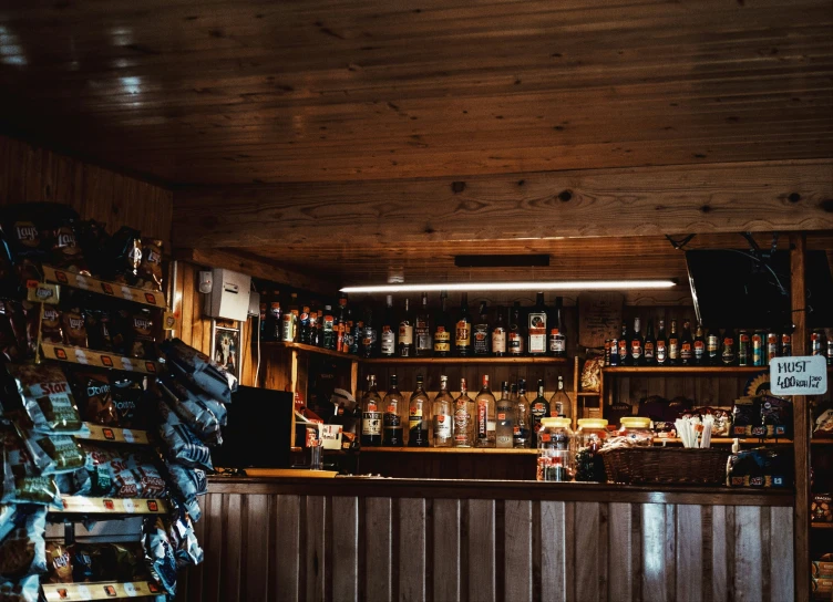 a restaurant with shelves filled with liquor bottles