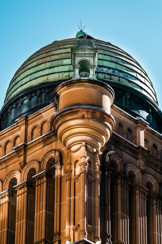 there is a building with domes and a flag flying in the sky