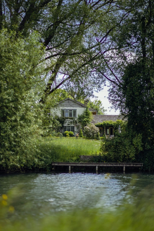 a white house nestled near a river