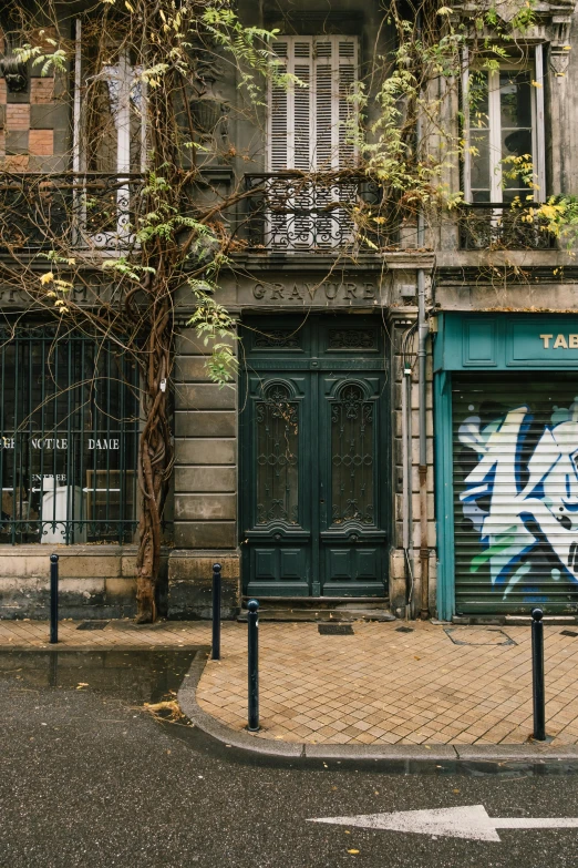 a couple of doors that are on the side of a building