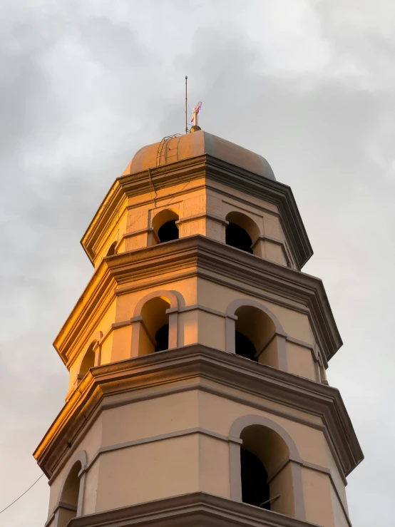 the view of an ornate tower top in the dusk