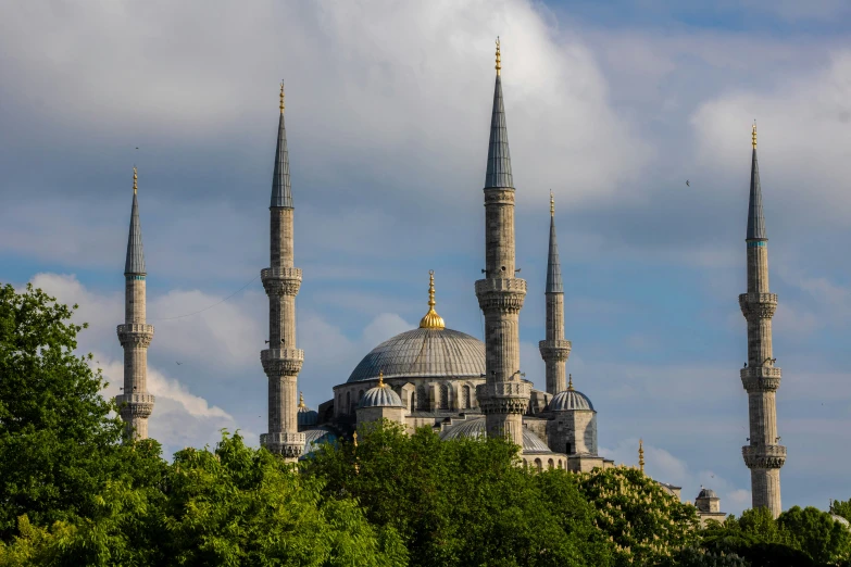 an image of two beautiful towers and some trees