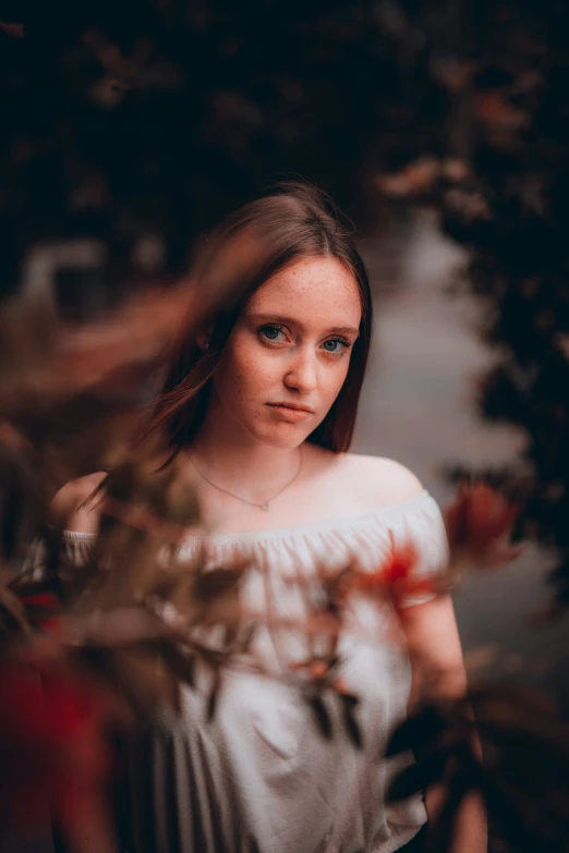 a close up of a person with a white top