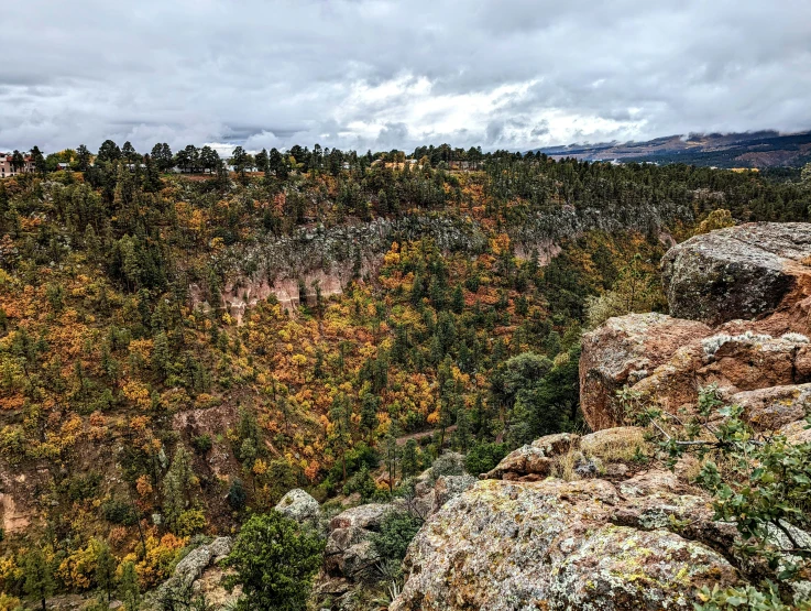 the top of a large cliff in a mountainous area