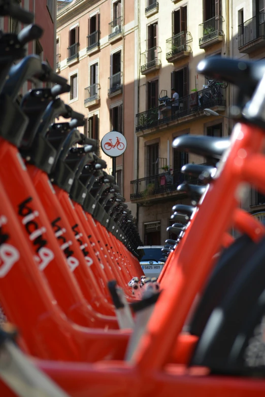 there are rows of bicycles parked along the road