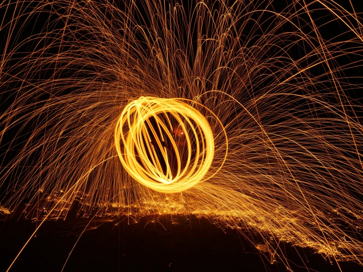 a large spinning fire with a circle in the middle