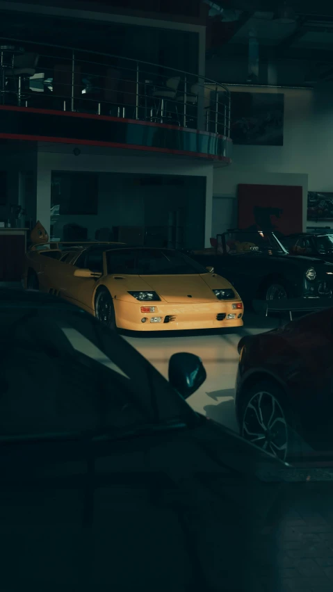 two gold cars parked in the parking lot