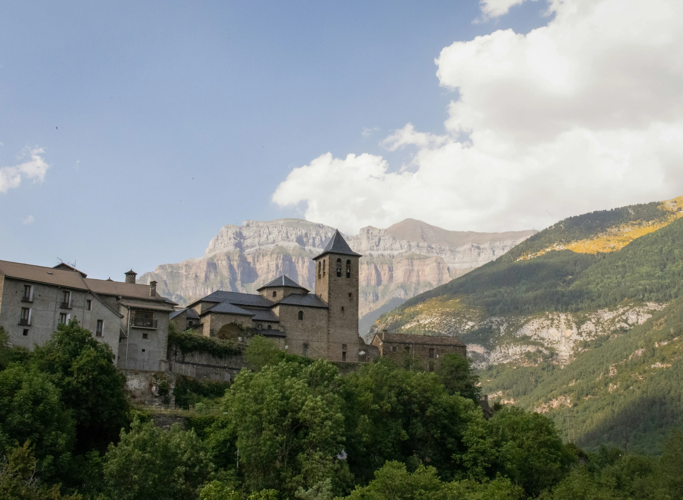 an old building sits on top of a hill