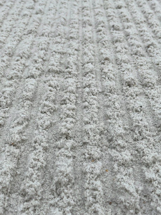 an empty baseball field covered in snow