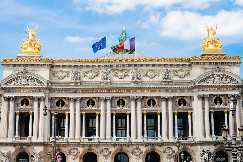 a very large building with statues on top