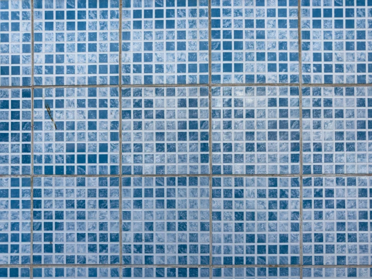 blue tiles with white designs, the shape of a square