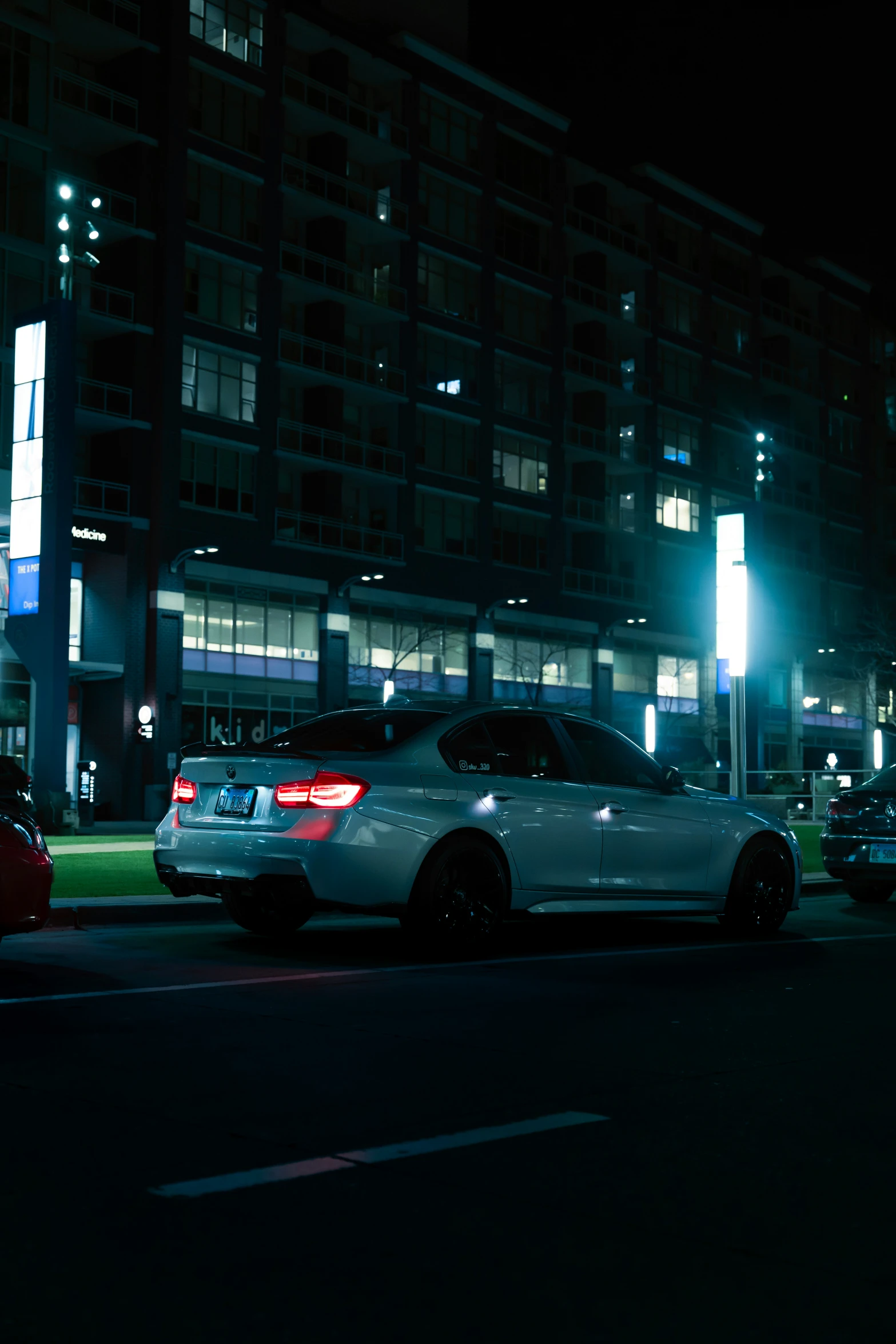 a police car parked on the side of a street at night