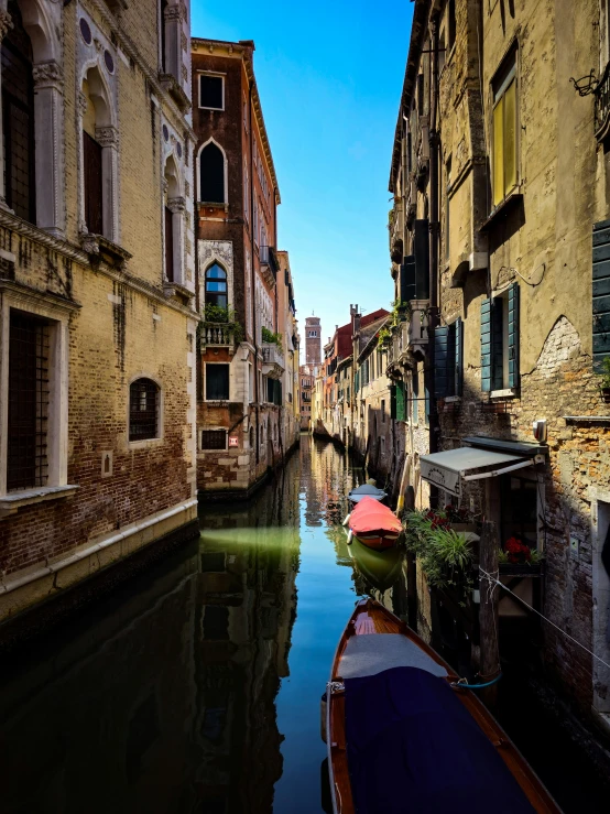 a view of a canal and buildings from a boat