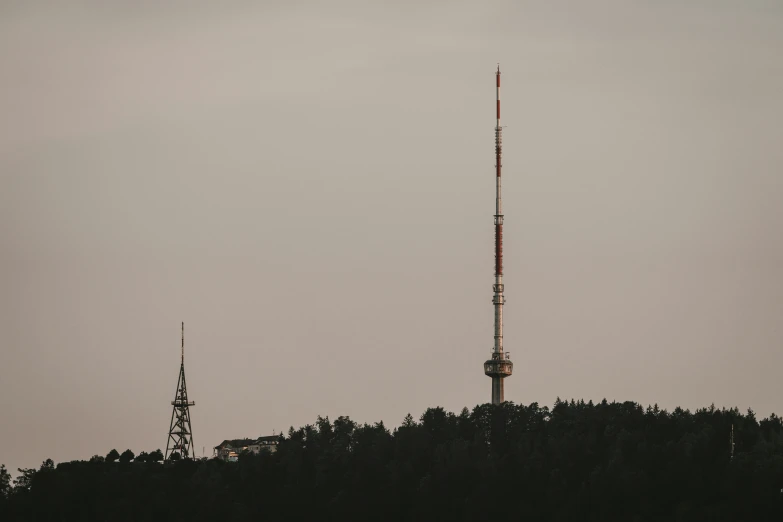 a tall radio tower is seen in the background